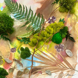 Framed artwork with green foliage and abstract background